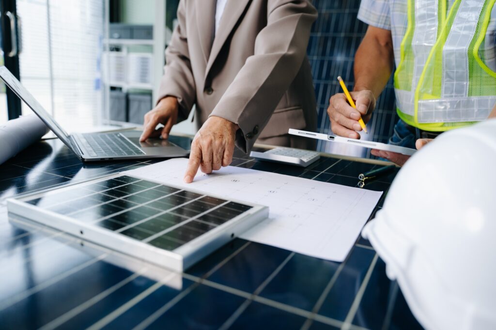 Engineers collaborate on solar and wind energy, driving sustainability, innovation, and clean tech